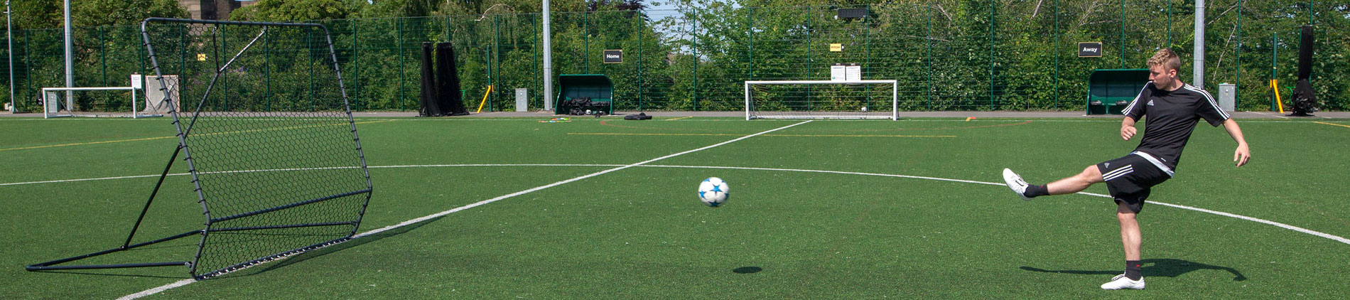 Man using a soccer rebounder